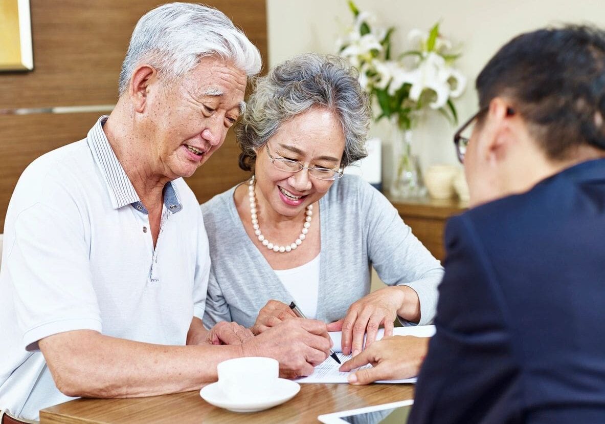 A couple of people sitting at a table